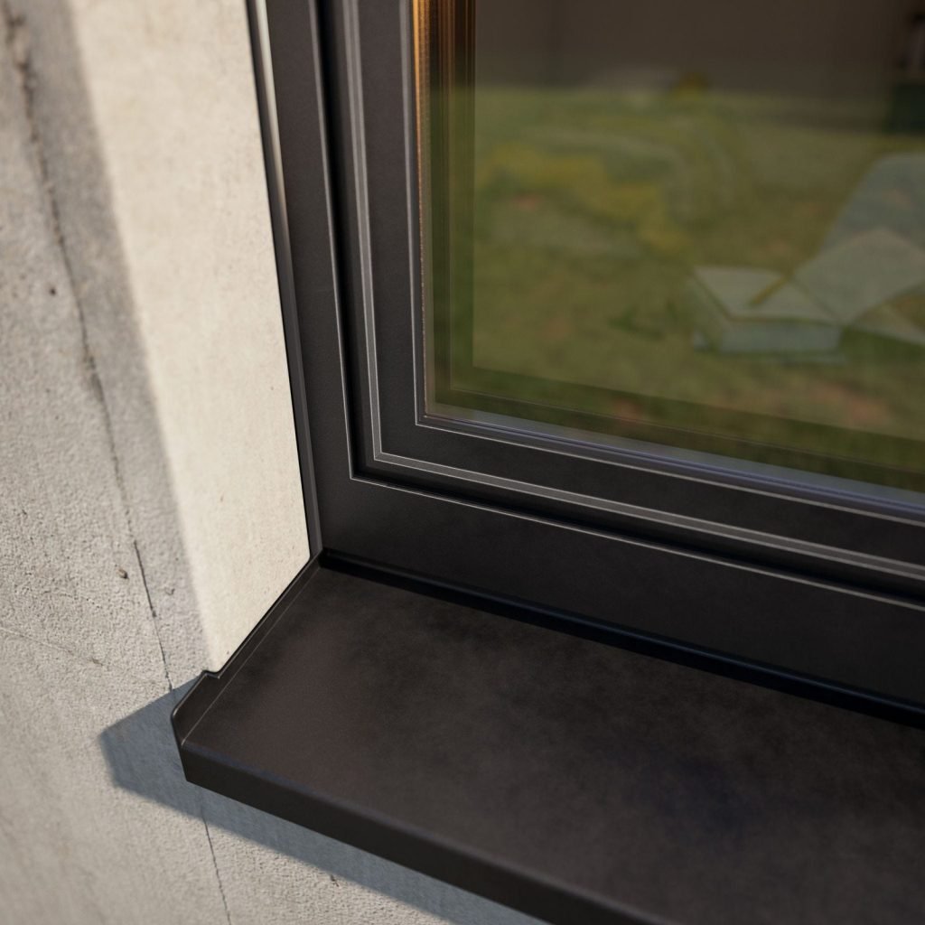 Hoekdetail van een Decalu 88 New Steel aluminium kozijn in een betonnen gevel